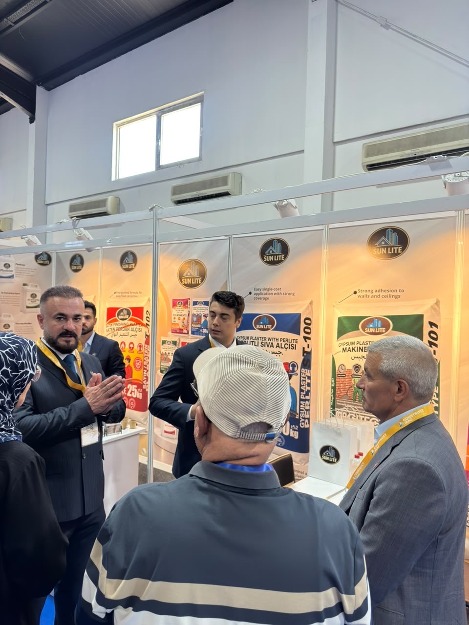 Explaining the plaster range to visitors